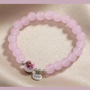 Rose quartz round beaded bracelet with heart pendant and love charm
